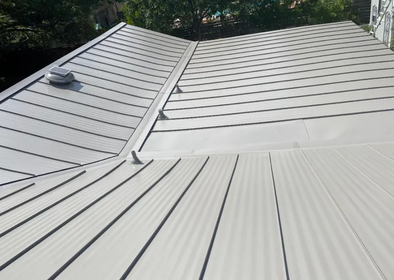 Solar attic fan installed on a metal roof for Roof Ventilation in Cerritos